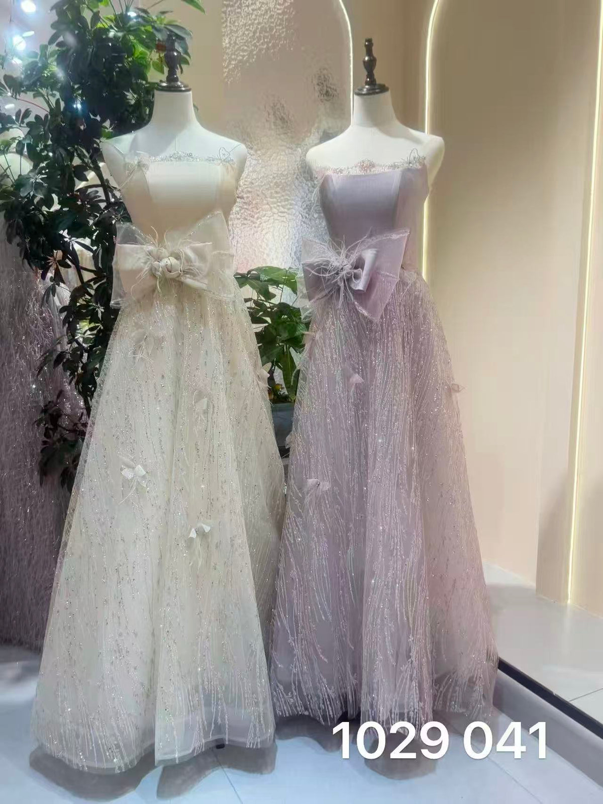 Enchanted Shimmer Off-White Strapless Evening Gown with Dramatic Waist Bow